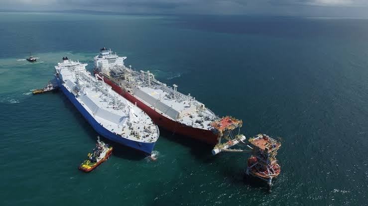 Aerial view of LNG carrier alongside FSRU during transfer operations